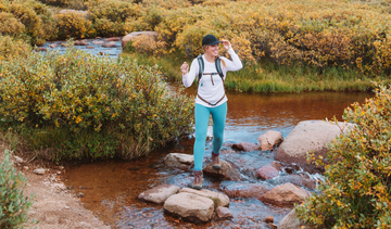 Woman wearing a Vapor Apparel hiking sun shirt