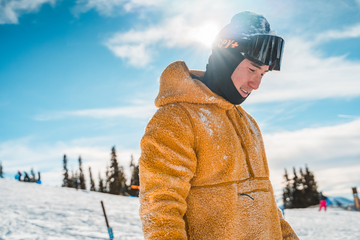 Man-on-ski-run-with-sun-beating-down