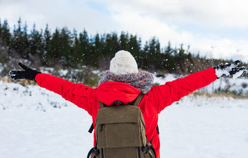 woman-throwing-snow-in-air